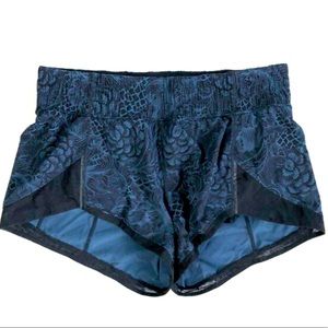 Lululemon “Miles Ahead” floral athletic shorts, navy print, size 4.